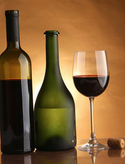 A full wineglass and a botte, closeup