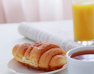 Croissants, coffee, orange juice .