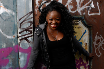 Naklejka premium Close up Happy Black Woman Posing at Wall