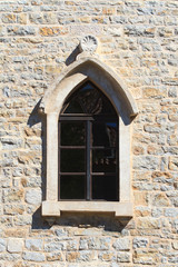 Window with an arch in the old town of Budva. Montenegro