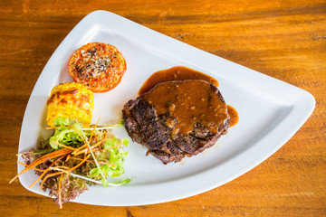 grilled beef with tomato and corn