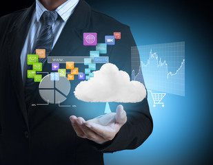 businessman with financial symbols coming from hand 