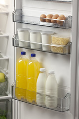 opened refrigerator full of foodstuff and drinks
