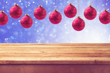 Empty wooden deck table with hanging ball decorations