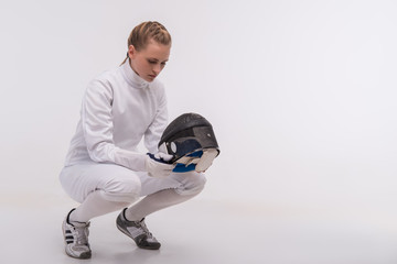 Young woman engaging in fencing