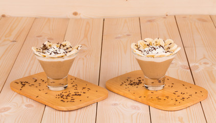 Fresh made Banana Milkshake on wooden background
