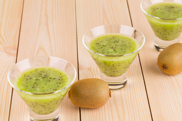 Kiwi juice on the wooden desk