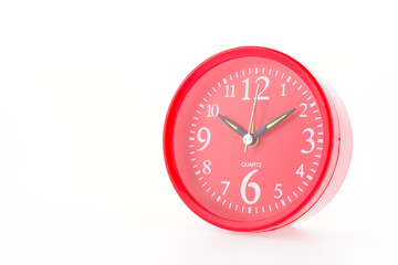 Red clock isolated on white background