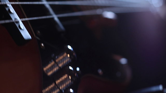 Close-up of hands of a bass guitar player