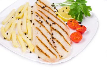 Grilled fish with fresh tomatoes and french fries