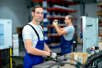 two man wokring in a factory