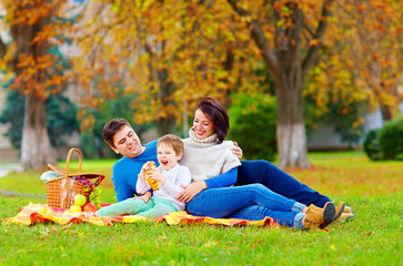 happy family enjoying autumn picnic