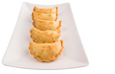 Popular traditional Malaysian snack curry puff on a white plate