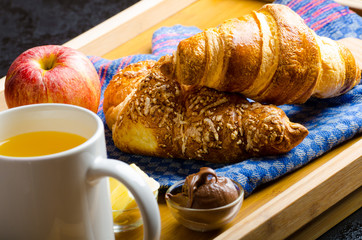 Breakfast in bed on wood tray