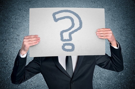 Man cover face with question board