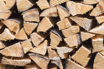 Stack of firewood - wooden abstract background