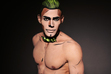 muscular man with make up for Halloween party