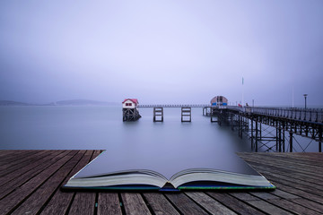 Long exposure landscape of Victorian pier  witn moody sky concep