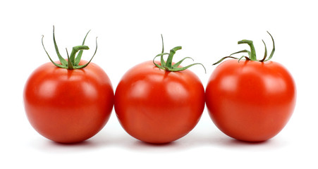 Three tomatoes isolated on white background