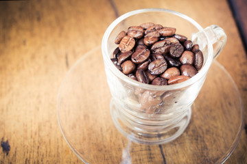 Roasted coffee bean on wood table