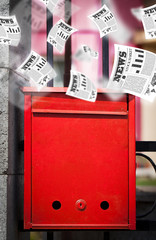 Post box with daily newspapers flying