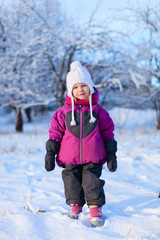 Fototapeta na wymiar Little girl outdoors on winter day