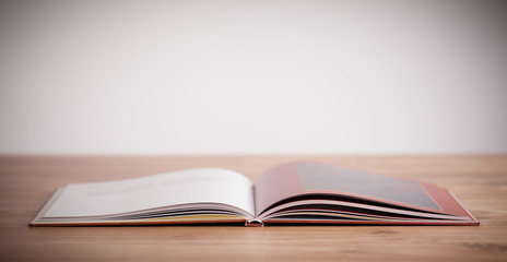 Open book on wooden deck