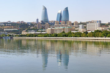 Fototapeta na wymiar View from Caspian Sea on Flame Towers skyscrapers in Baku