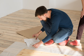 Man Putting Together Self Assembly Furniture