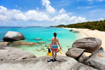 Fototapeta premium Woman with snorkeling equipment at tropical beach