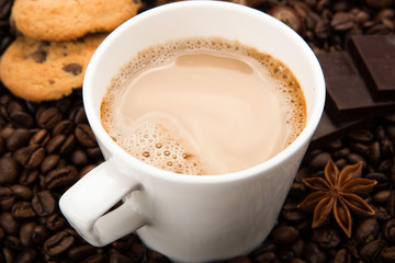 coffee beans coffee with cream in a cup