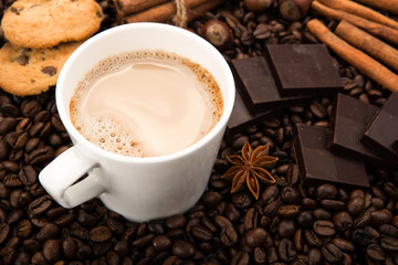 coffee beans coffee with cream in a cup
