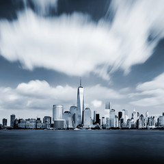 Obraz premium Modern Manhattan cityscape in blue color with blurred sky