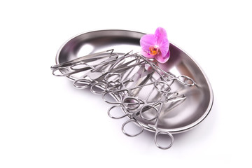surgical instruments orchid on white