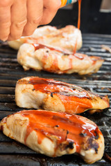 barbeque chicken cooking on the grill