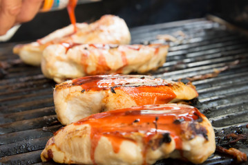 barbeque chicken cooking on the grill