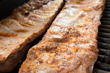 Barbeque ribs cooking on the grill