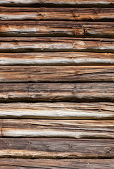 Wooden logs wall of old rural house background