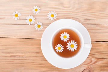 Cup of tea with chamomile.