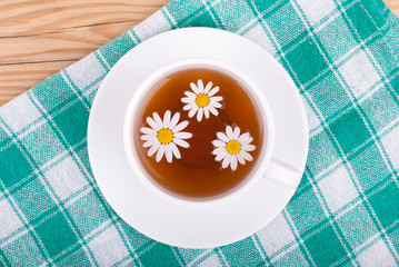 Cup of tea with chamomile.