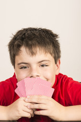 Young boy playing cards