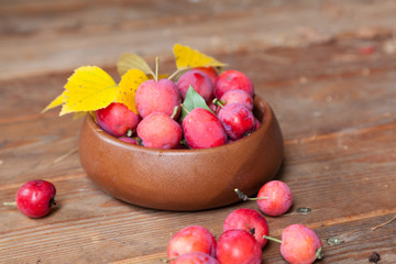 Crab apples in a wooden bowl
