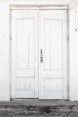 White wall and wooden door, background texture