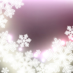 White defocused snowflakes on glow background. Christmas abstrac