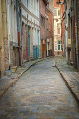 Fototapeta na wymiar Narrow old street in city. Valenciennes, France