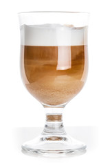 Glass mug full of latte coffee, closeup studio photo