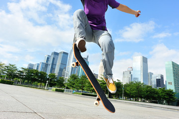  woman skateboarder skateboarding at city  