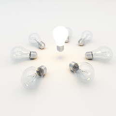 Idea concept with light bulbs on a gray background