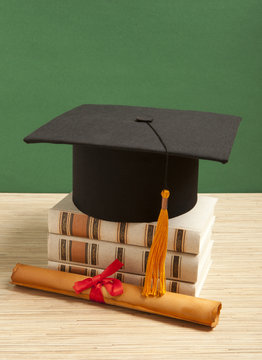 Gortarboard and graduation scrol