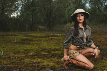 safari woman in  the morning swamp